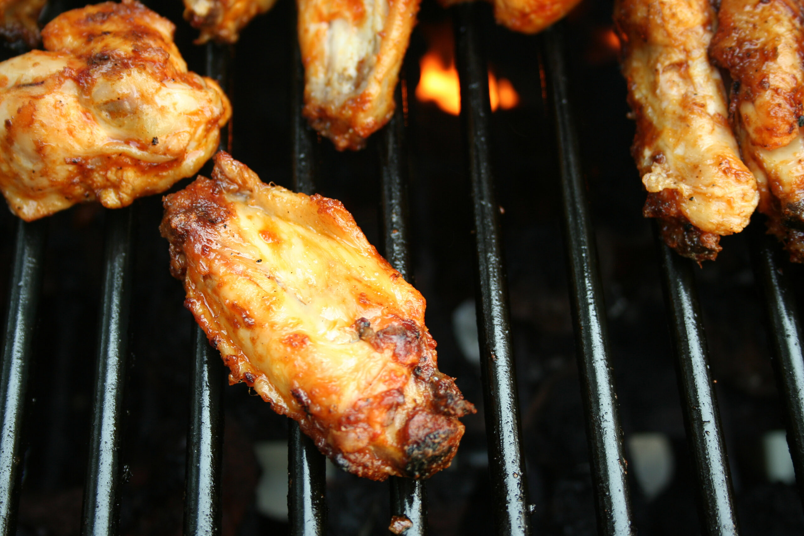 chicken wings cooking on the grill 2021 08 26 16 21 35 utc scaled
