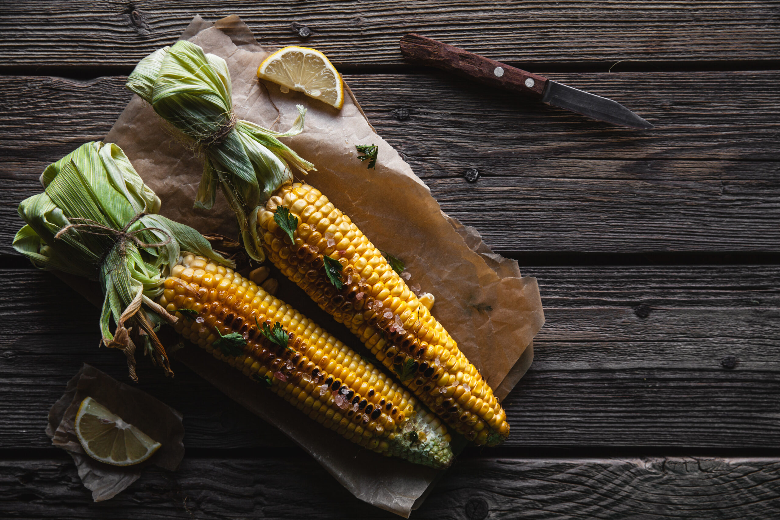 grilled corn cobs with sauce coriande on old wood 2021 08 27 09 46 49 utc scaled